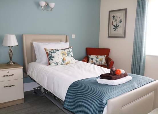 Cozy bedroom setting with floral decor and seating