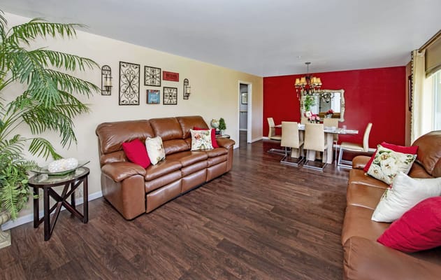 Bright living room area with couches and decor