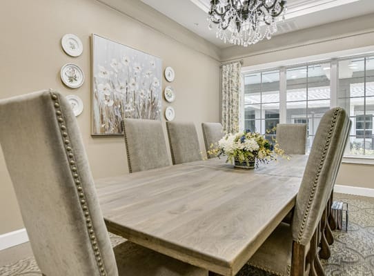 Elegant dining area with a large table and floral decor
