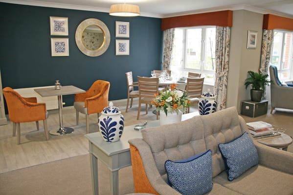 Bright common area with seating and dining tables