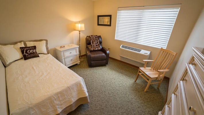 Cozy private room with bed and seating area