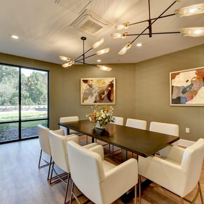 Interior view of a modern common area with a dining table