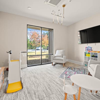 Bright and inviting common area with seating and windows