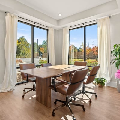 Bright meeting room with large windows overlooking outdoor space
