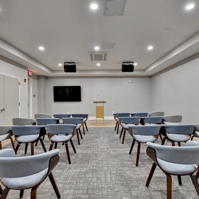 Empty activity room with chairs arranged for a presentation