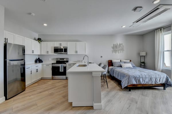 Modern interior of a resident's suite with kitchenette