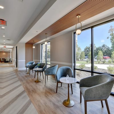 Bright common area with seating and natural light