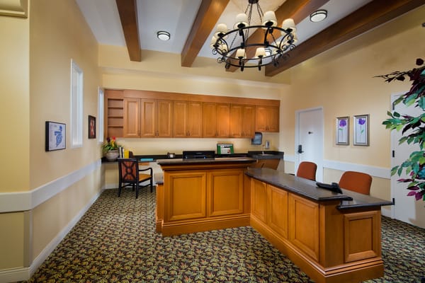 Interior reception area with a desk and chairs