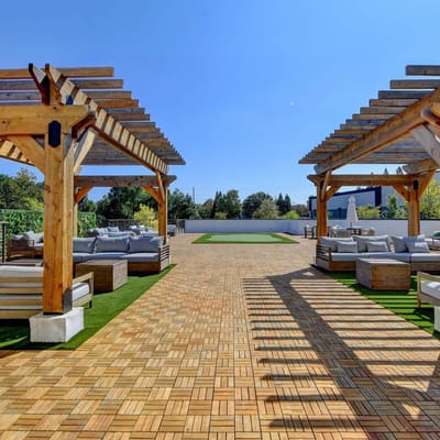 Outdoor patio area with seating and pergolas