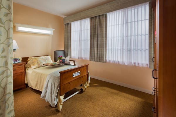 Cozy resident room with a bed and natural light