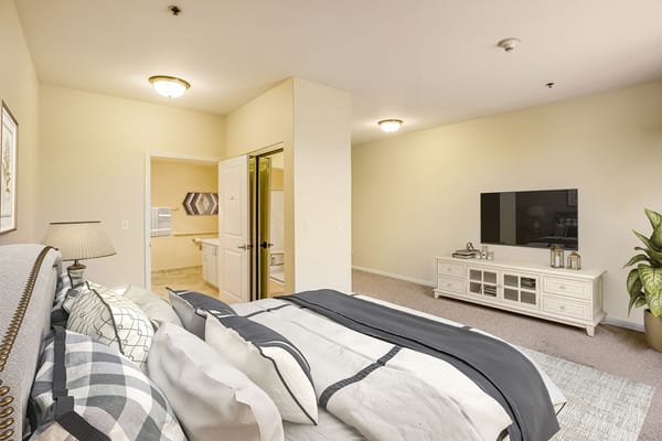 Bright and spacious private resident room with a TV