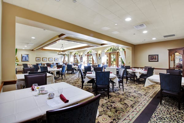Bright dining room with tables set for service