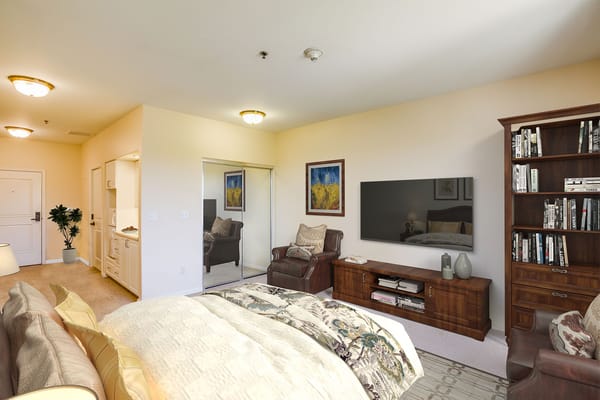 Bright private resident room with furniture and decor