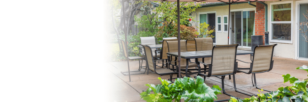 Outdoor seating area with tables and chairs