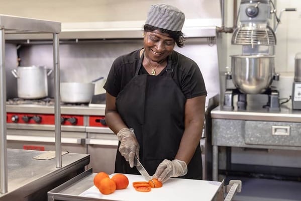 Staff member preparing food in the kitchen