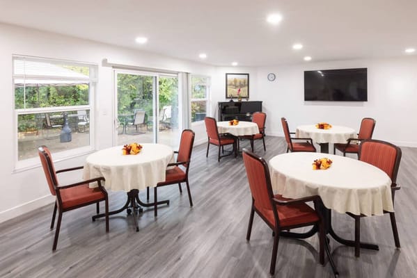 Bright common area with tables and chairs