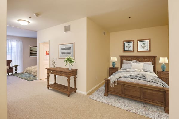 A cozy private resident room with a bed and décor