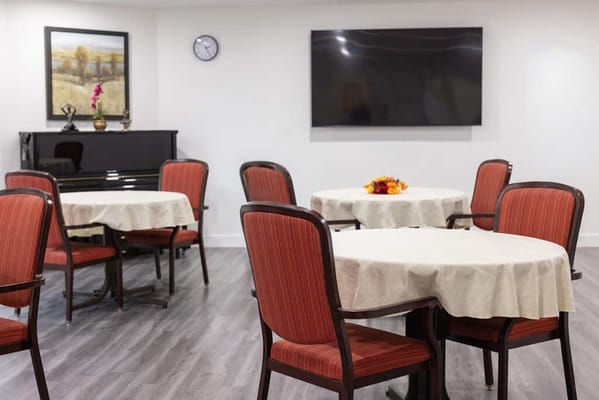 Interior of a common area with tables and chairs