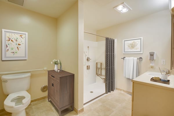 Clean and well-decorated bathroom in a resident room