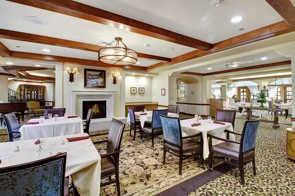 Dining area set for residents with a warm ambiance