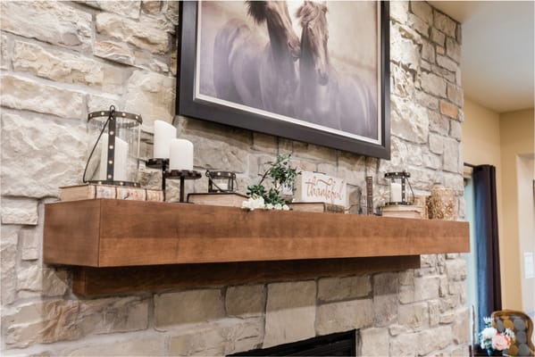 Cozy interior with a decorative mantel and artwork