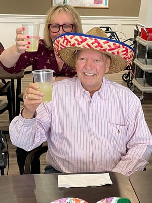 Residents enjoying a festive drink in the common area