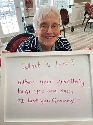 A resident holding a sign about love