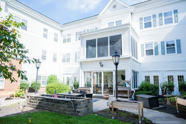 Outdoor area of the facility with seating and gardens