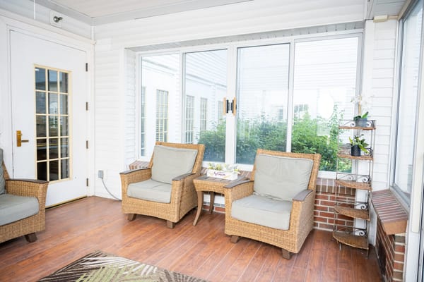 Bright sunroom with comfortable seating
