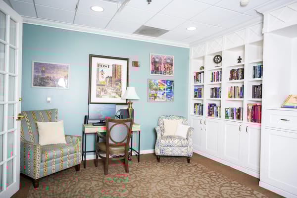 Cozy interior lounge area with bookshelves and seating