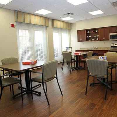 Bright common area with tables and chairs