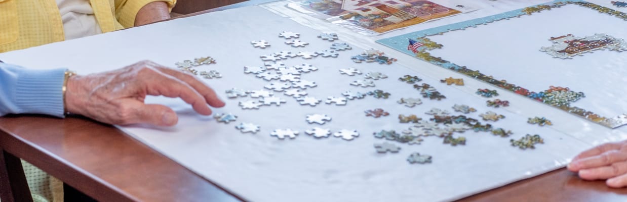 Residents working on a puzzle together