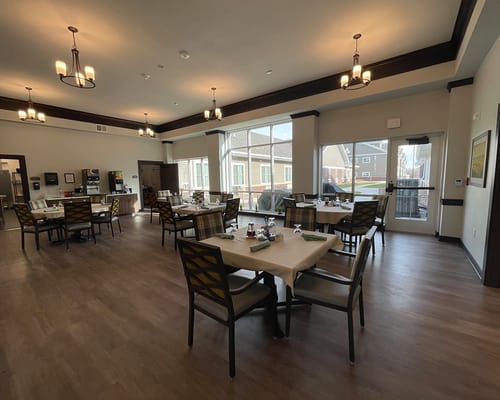 Dining room with tables and chairs set for a meal