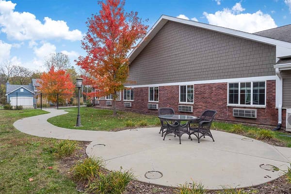Outdoor seating area with fall foliage