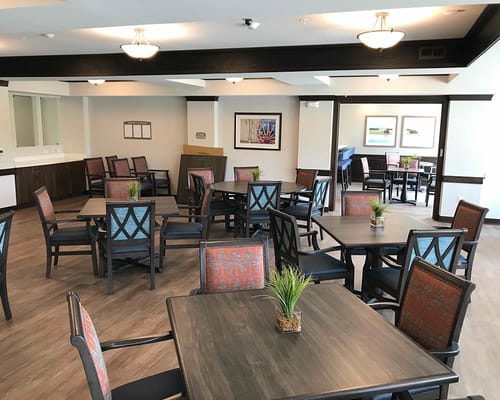 Bright interior of a common area with tables and chairs