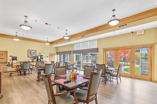 Bright dining area with tables and chairs