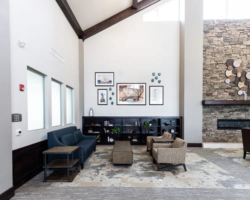 Bright common area with seating and artwork