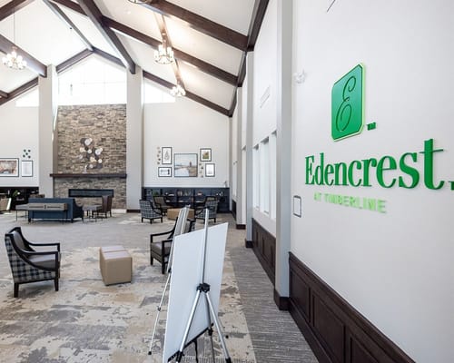 Common area of a senior living facility with seating and decor