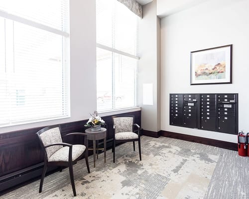 Interior lobby area with chairs and mailboxes
