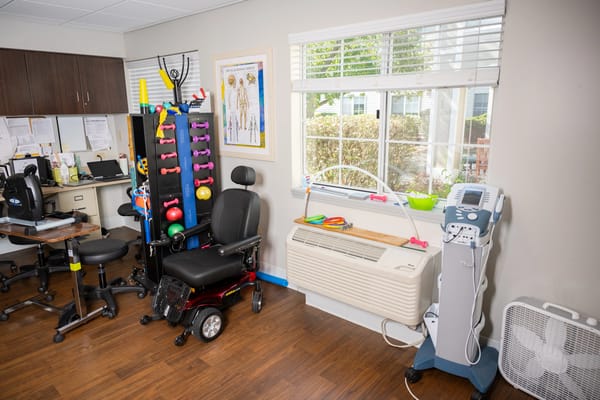 Rehabilitation equipment in a well-lit therapy room