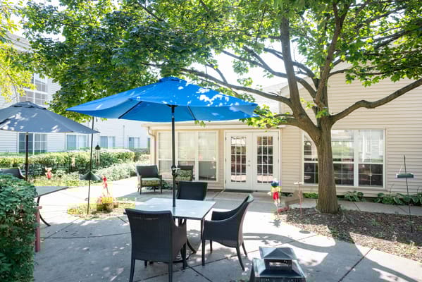 Patio area with seating and umbrellas at Eden Vista