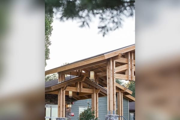 Exterior view of a building entrance with wooden architecture