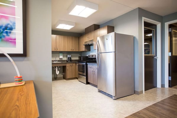 A kitchen area in a modern assisted living facility