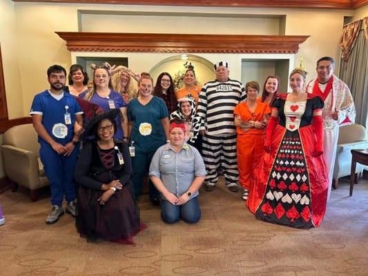 Staff and residents dressed in costumes for an event