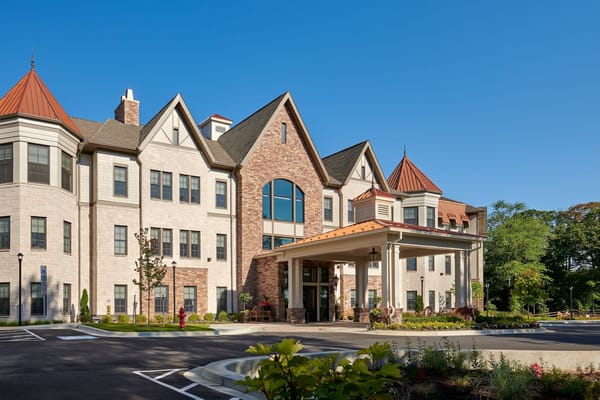 Exterior view of a senior living facility with welcoming entrance