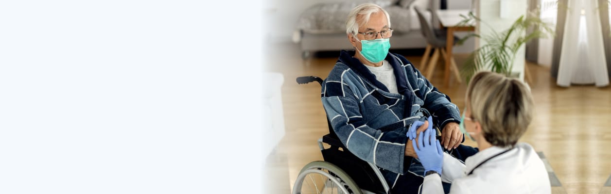 Healthcare worker assisting a resident in a wheelchair