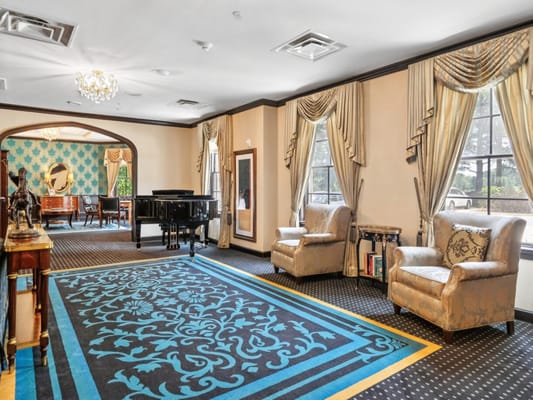 Interior common area with piano and seating