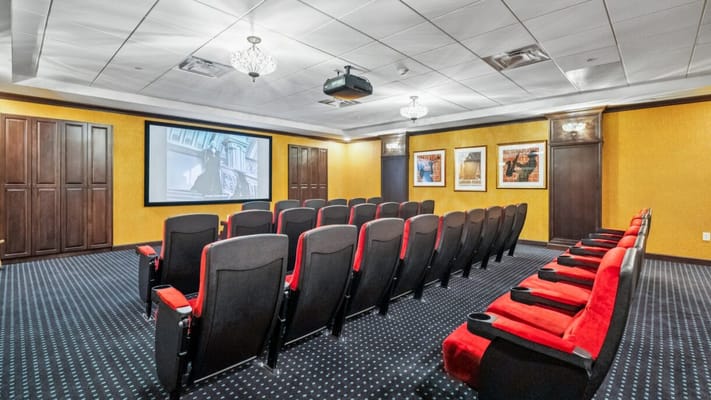 Interior of a movie theater room with seating