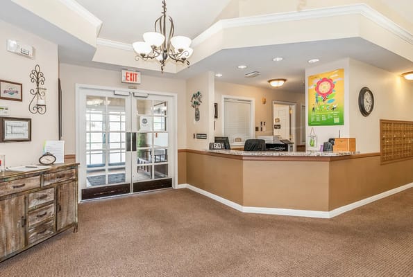 Bright lobby area with reception desk and seating