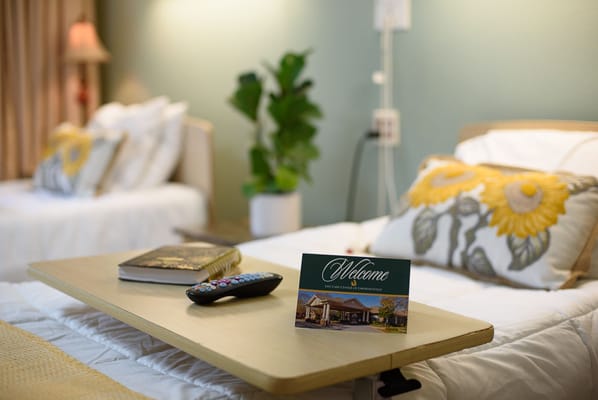 Cozy resident room with welcome card and decor
